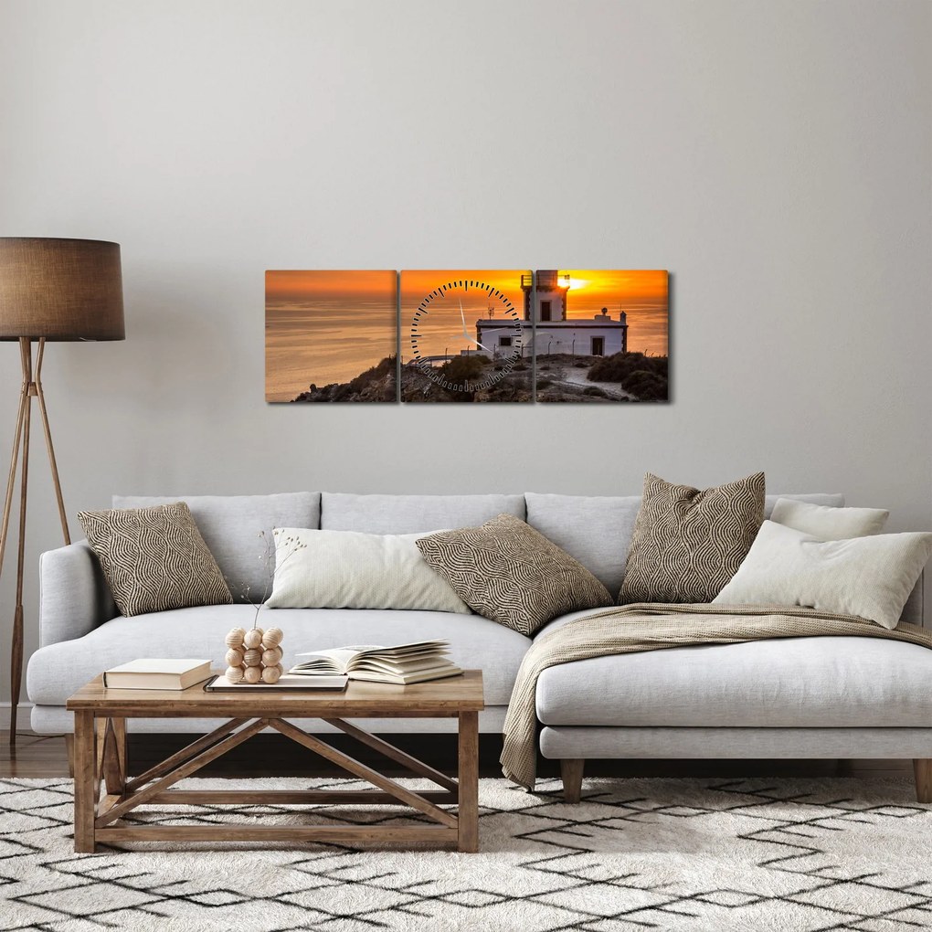 Obraz latarni morskiej o zachodzie słońca (z zegarem) (90x30 cm)