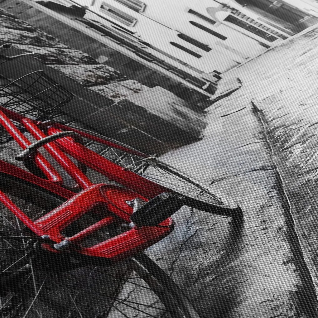 Obraz czerwonego roweru na brukowanej uliczce (125x70 cm)