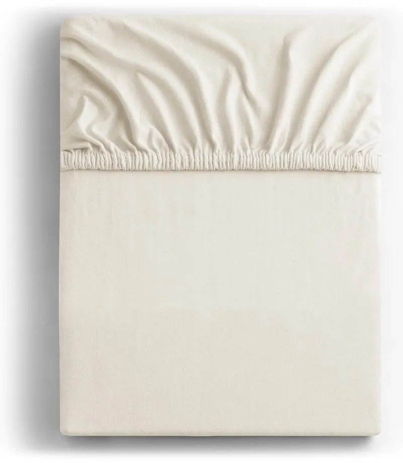 Kremowobiałe dżersejowe prześcieradło z gumką 240x200 cm Amber – Restilo