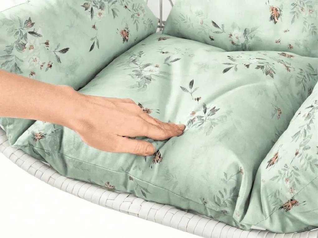 Białe wiszące krzesło KOKON bez stojaka, jasnozielona poduszka ze wzorem