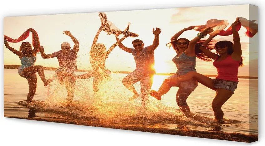 Obraz canvas na ścianę Ludzie nad Morzem o Zachodzie