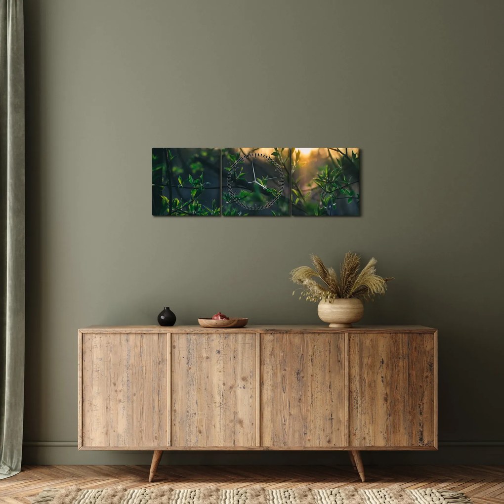 Obraz słońca przeświecającego przez gałęzie drzew (z zegarem) (90x30 cm)