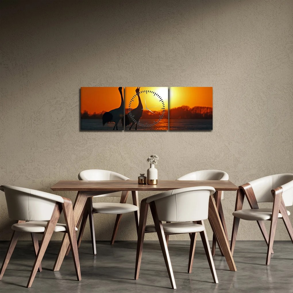 Obraz ptaków o zachodzie słońca (z zegarem) (90x30 cm)