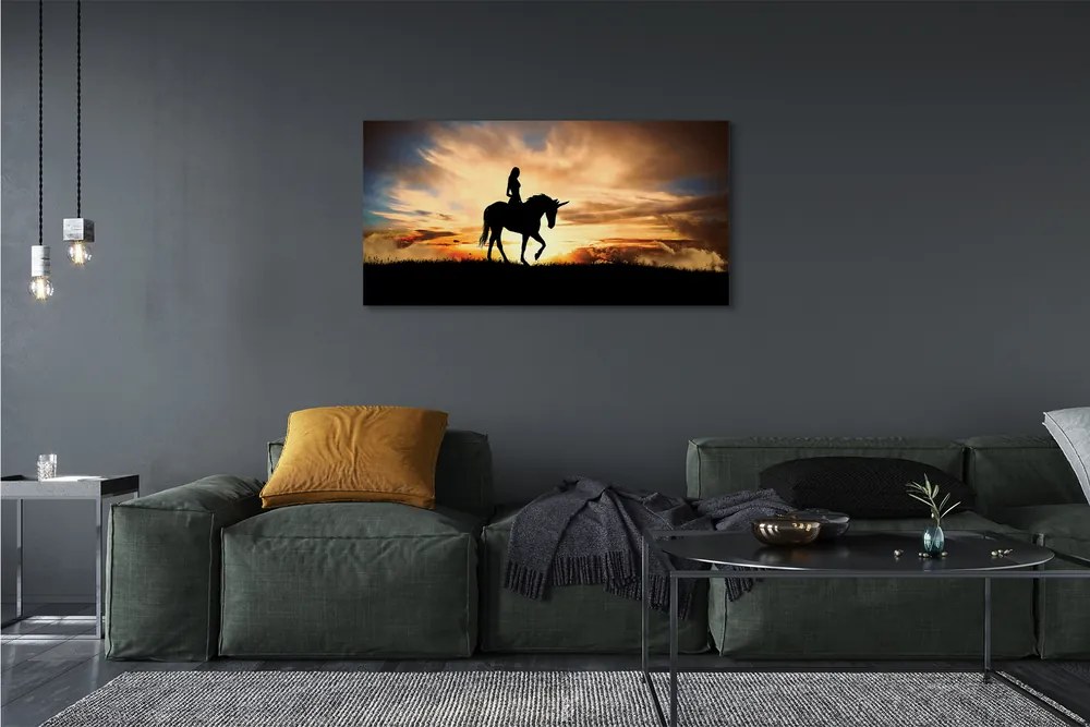 Obraz na płótnie Kobieta na Jednorożcu o Zachodzie Słońca