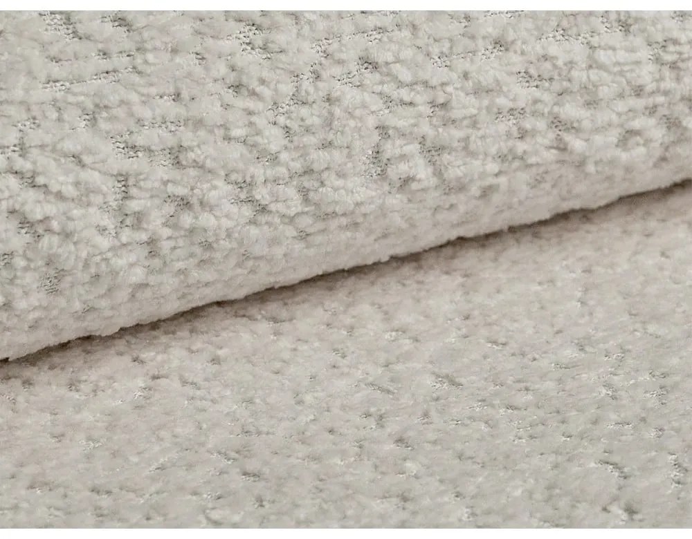 Beżowa rozkładana sofa z materiału bouclé 206 cm Kemi – Cosmopolitan Design