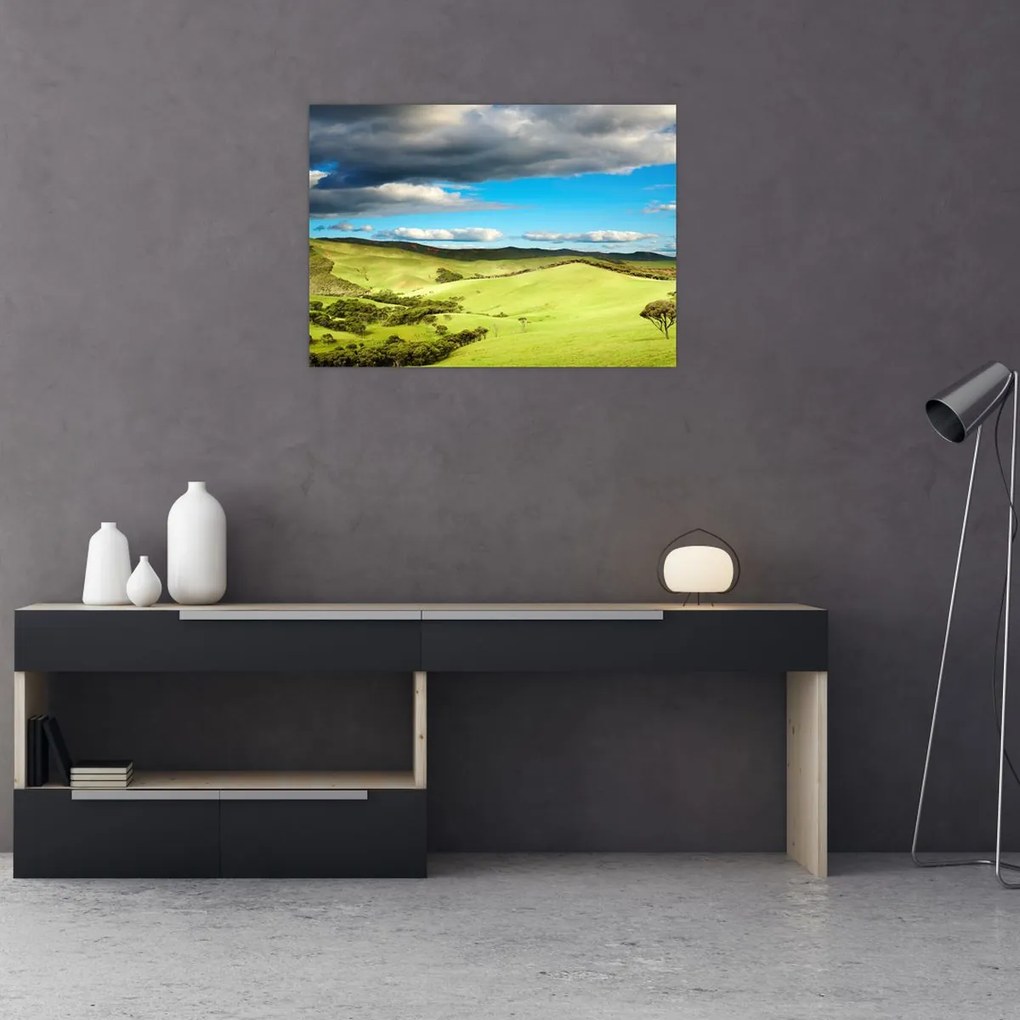 Obraz na szkle - Zielony krajobraz ze wzgórzami (70x50 cm)