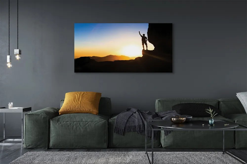 Obraz drukowany na płótnie Człowiek w Górach o Zachodzie