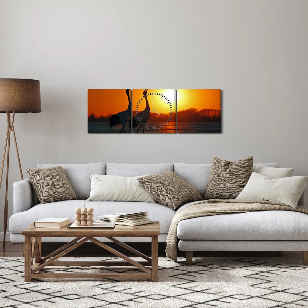 Obraz ptaków o zachodzie słońca (z zegarem) (90x30 cm)