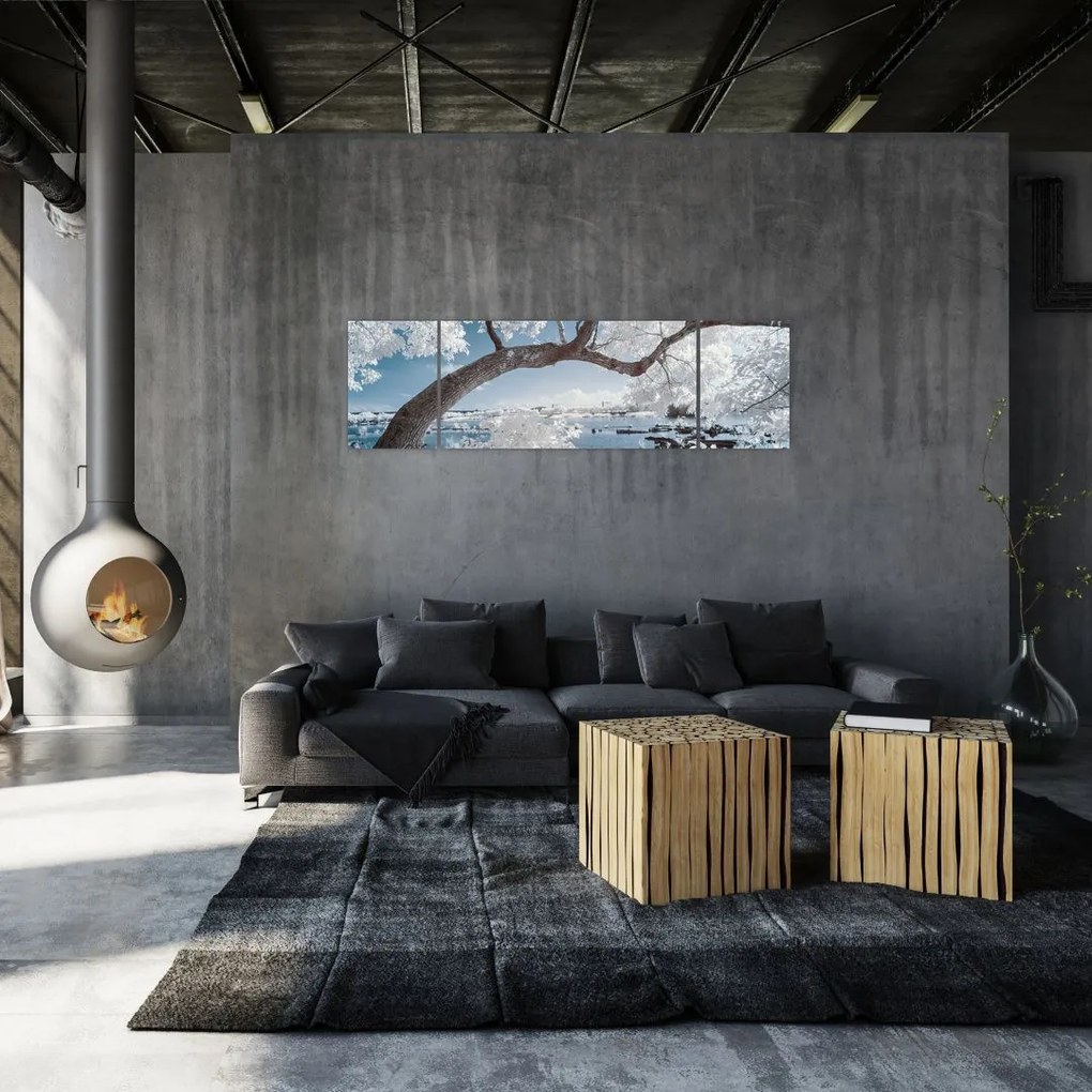 Obraz ośnieżonego drzewa nad wodą (170x50 cm)