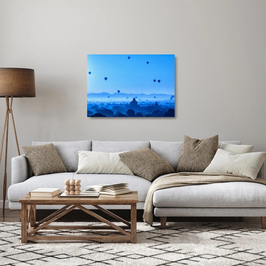 Obraz na szkle - Balony nad krajobrazem (70x50 cm)