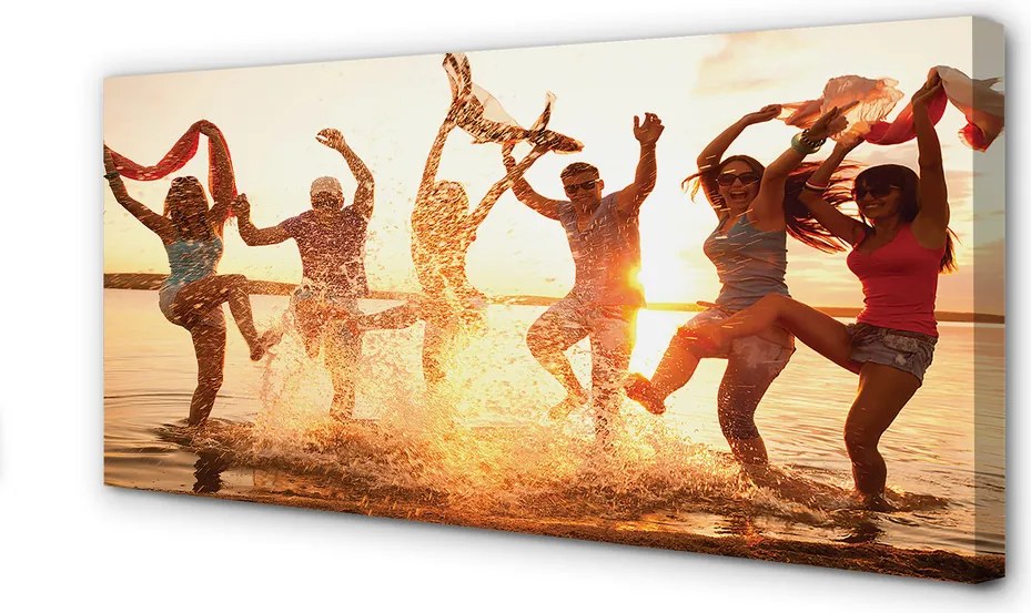 Obraz canvas na ścianę Ludzie nad Morzem o Zachodzie