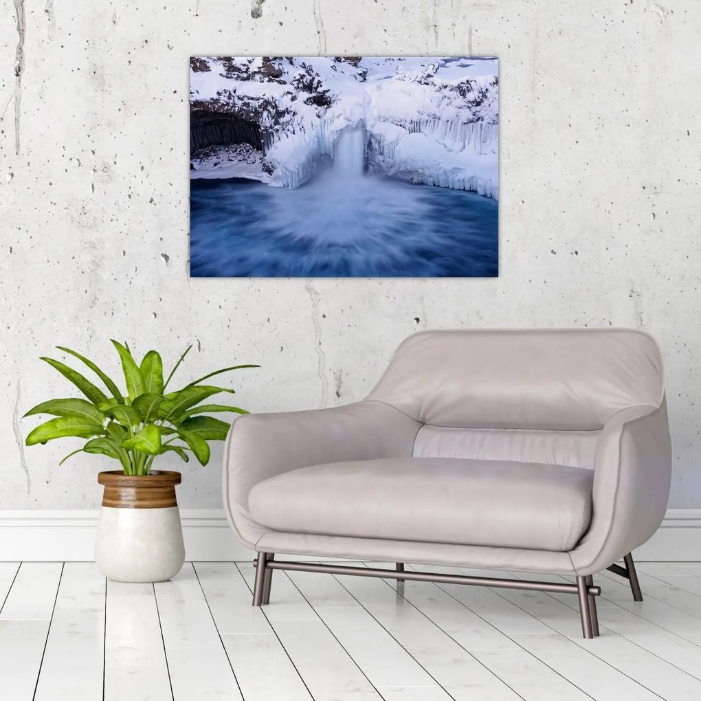 Obraz na szkle wodospadu zimą (70x50 cm)