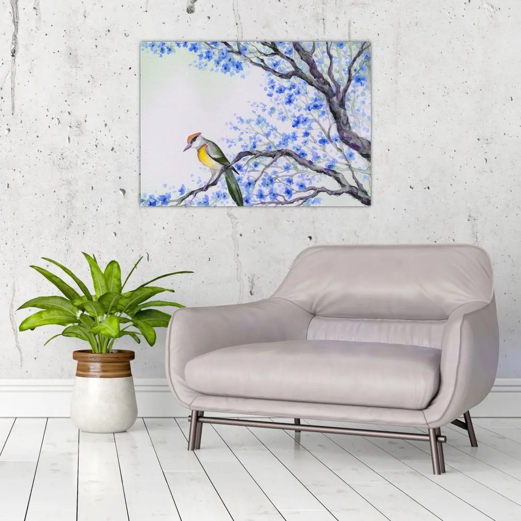 Obraz - ptak na drzewie z niebieskimi kwiatami (70x50 cm)