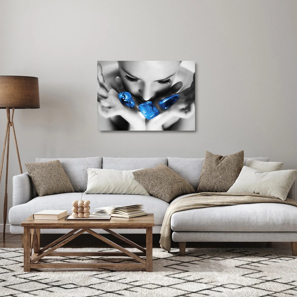 Obraz na szkle portretu kobiety z kamieniami (70x50 cm)