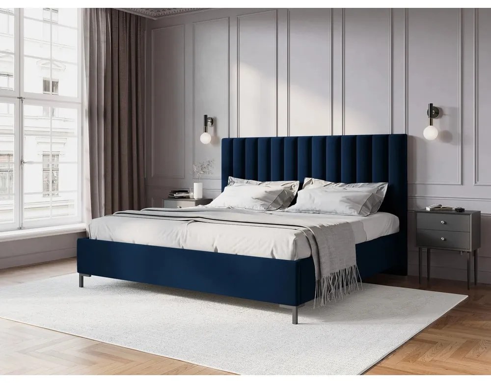 Ciemnoniebieskie tapicerowane łóżko dwuosobowe ze schowkiem i stelażem 180x200 cm Casey – Mazzini Beds