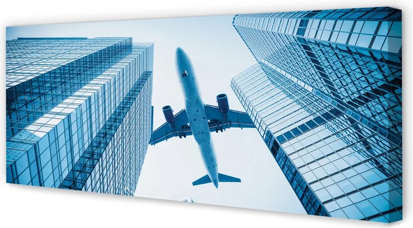 Obraz na płótnie Samolot nad Dachami Miasta