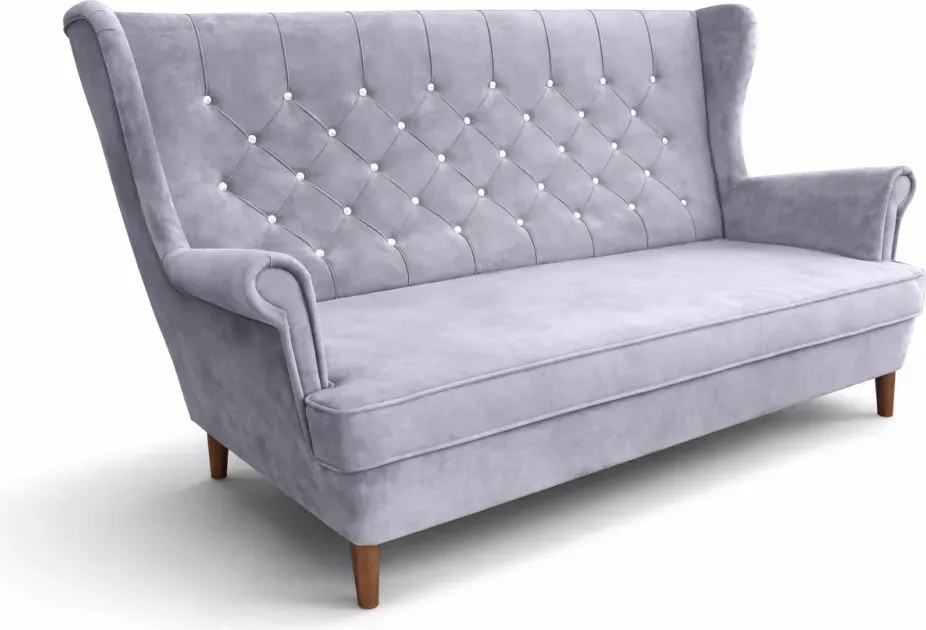Nowoczesna sofa uszak z przeszyciami i pikowaniem po całości
