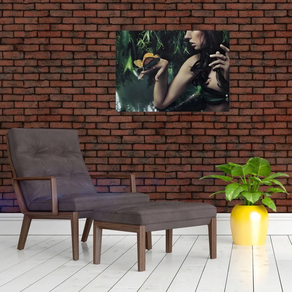 Obraz na szkle pełnej wdzięku kobiety z motylem (70x50 cm)
