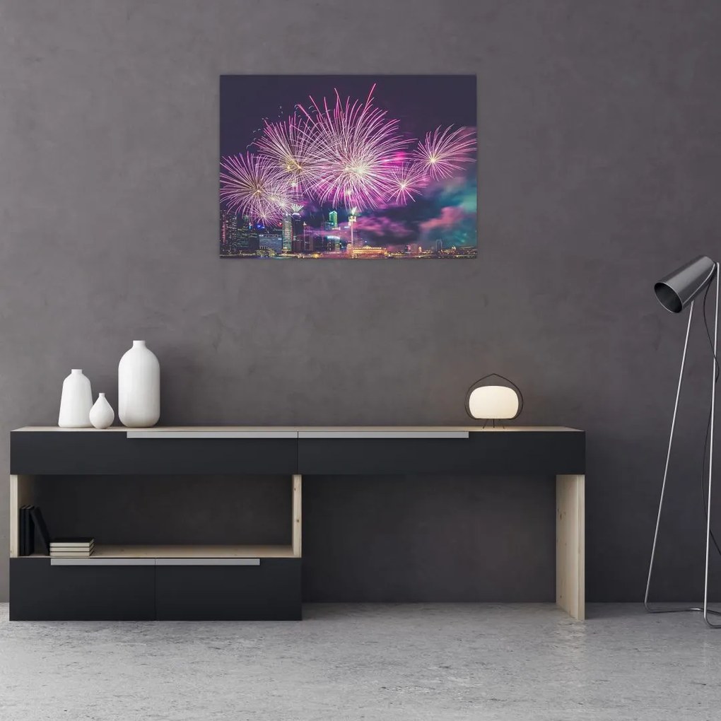 Obraz na szkle - nocne miasto z fajerwerkami (70x50 cm)