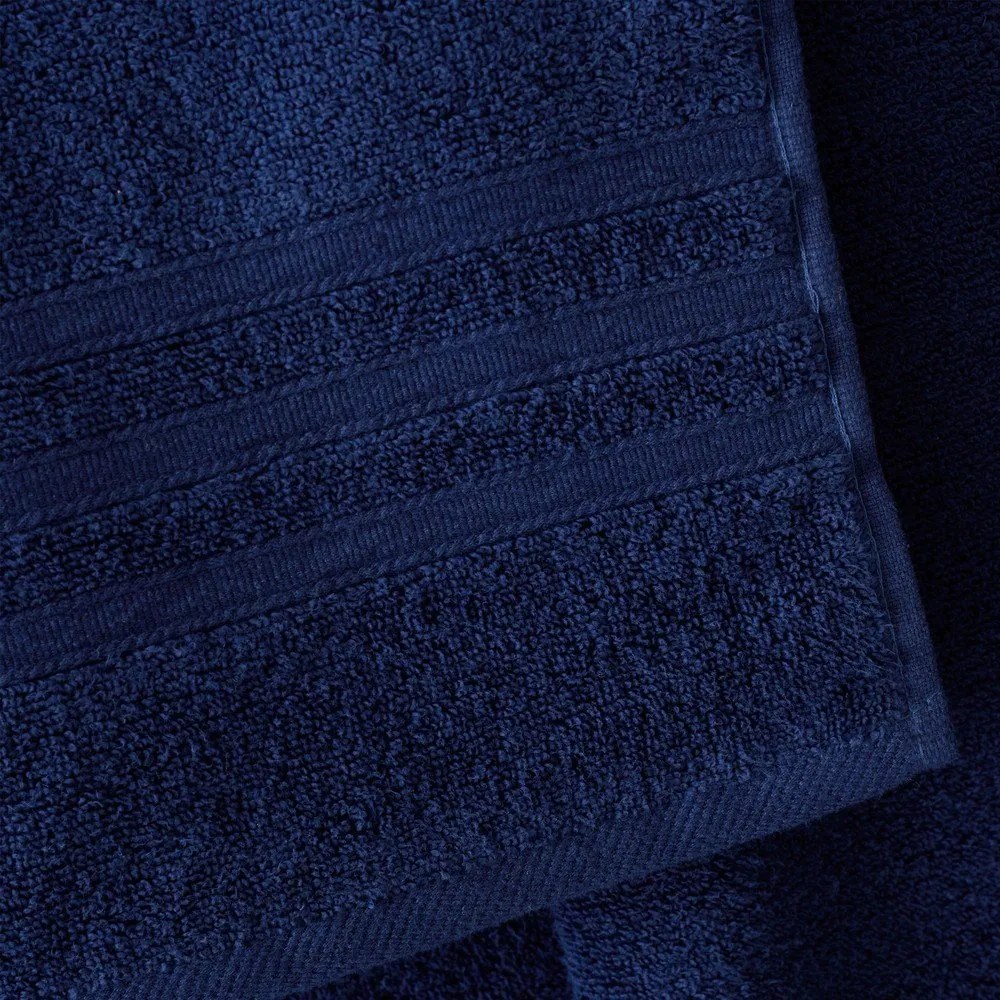 Ciemnoniebieskie bawełniane ręczniki kąpielowe frotte zestaw 2 szt. 90x140 cm Zero Twist – Catherine Lansfield