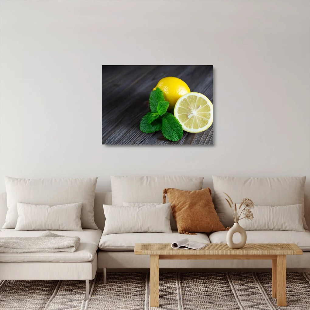 Obraz na szkle - cytryn i mięty na stole (70x50 cm)