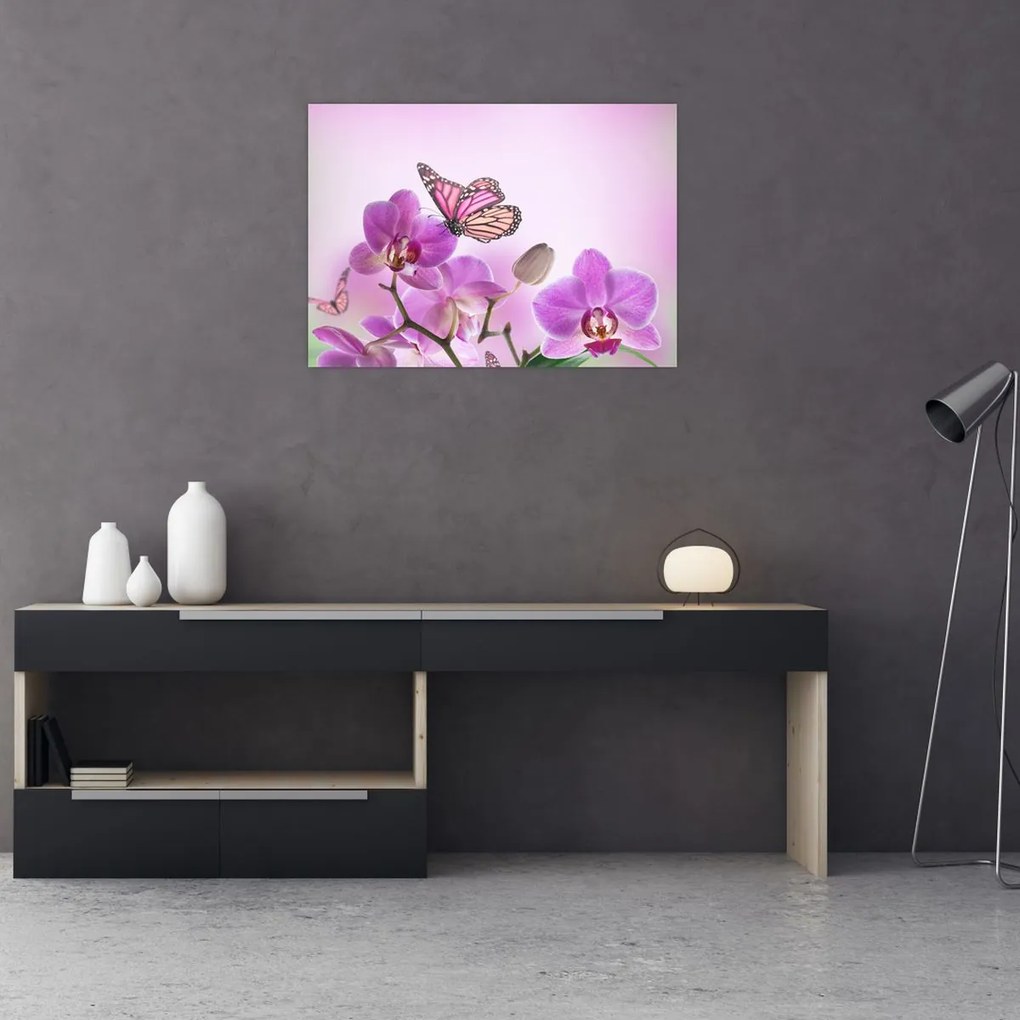 Obraz - Motyl na kwiatach orchidei, liliowy (70x50 cm)