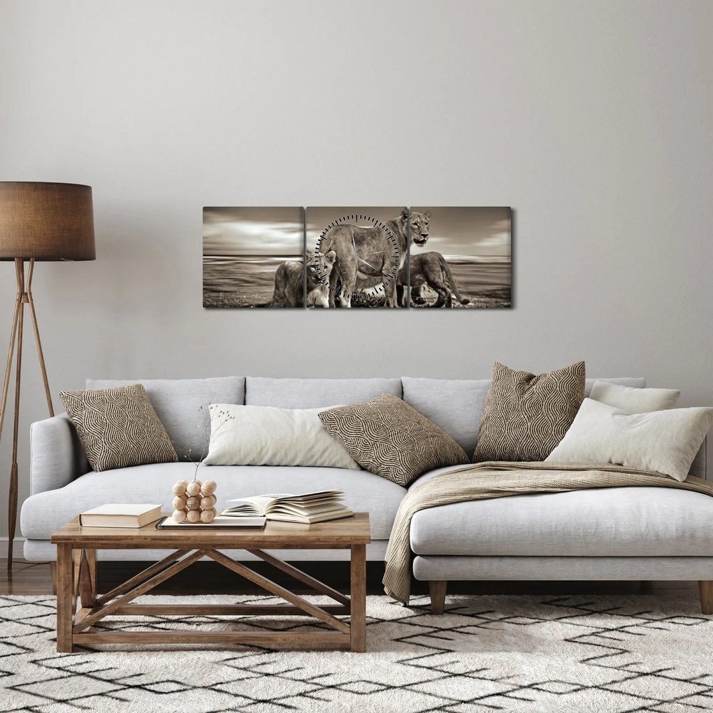 Obraz czarno - białych lwów (z zegarem) (90x30 cm)