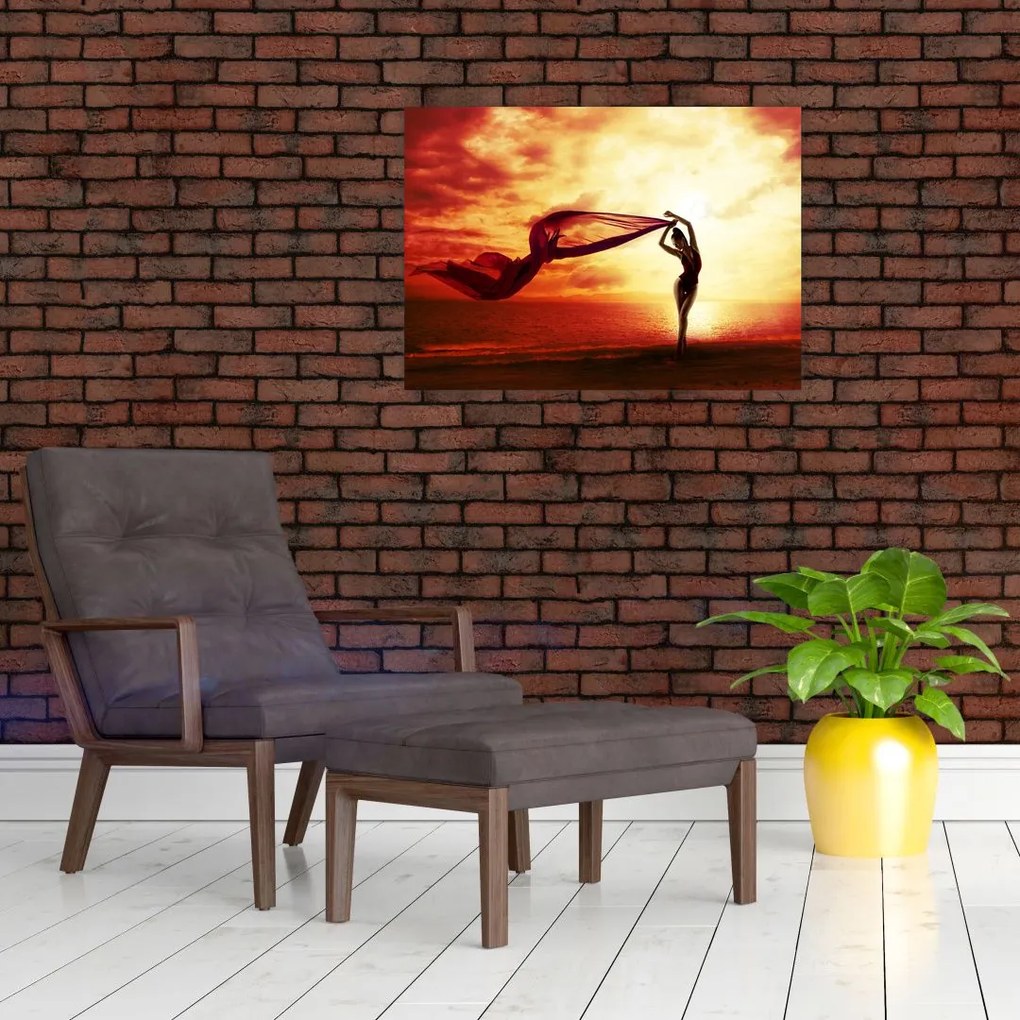 Obraz - Sylwetka kobiety o zachodzie słońca (70x50 cm)