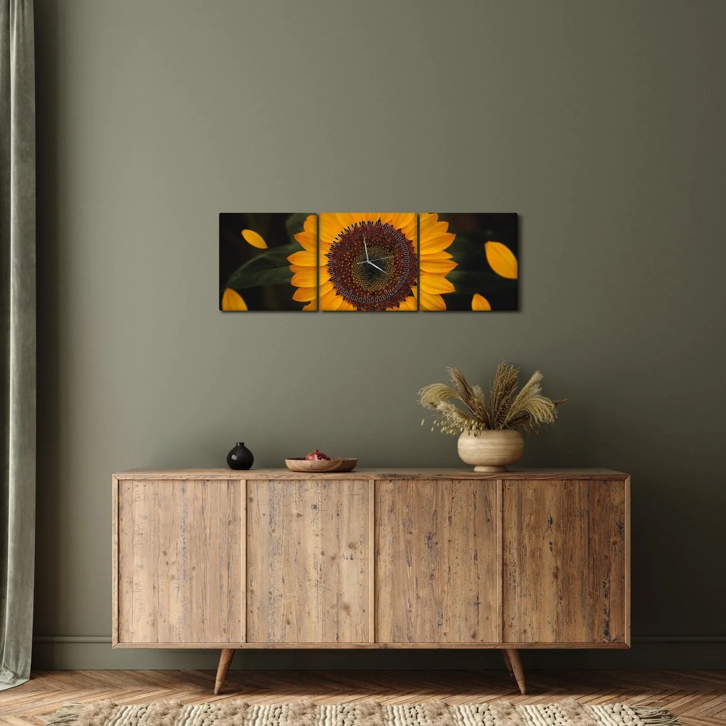 Obraz - Słonecznik i płatki kwiatów (z zegarem) (90x30 cm)