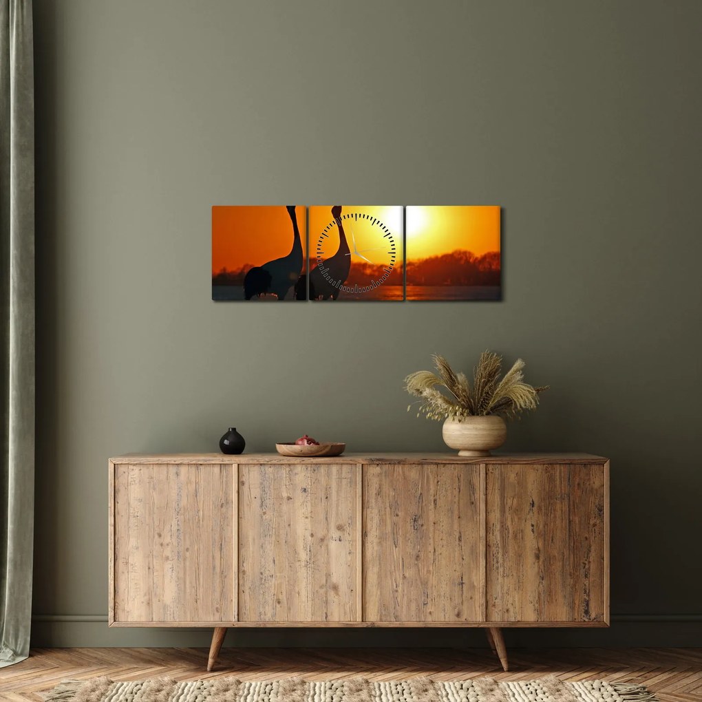 Obraz ptaków o zachodzie słońca (z zegarem) (90x30 cm)