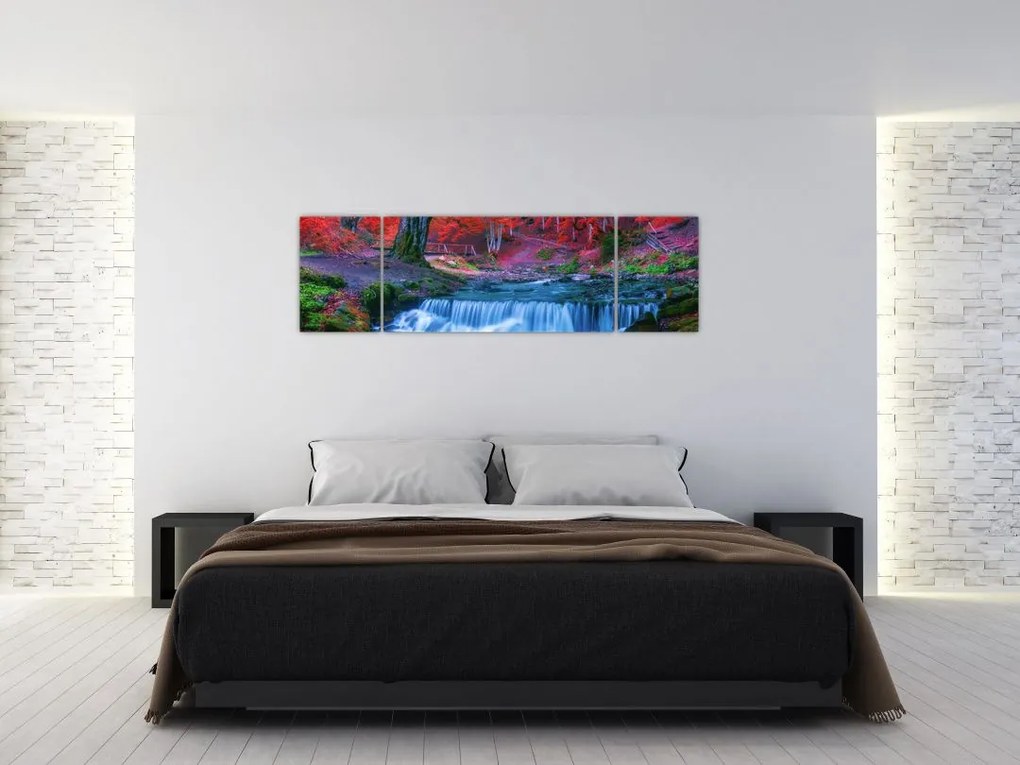 Obraz wodospadu w czerwonym lesie (170x50 cm)
