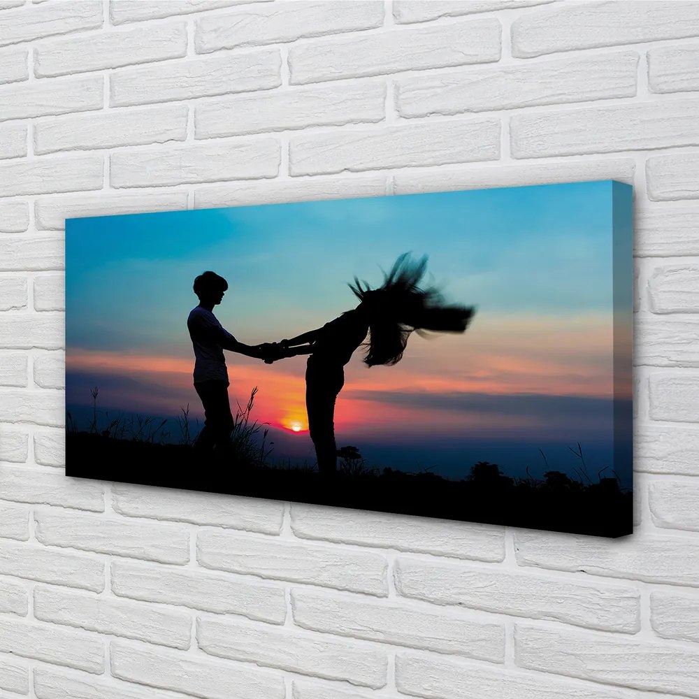 Fotoobraz na płótnie Ludzie na Tle Zachodu Nieba