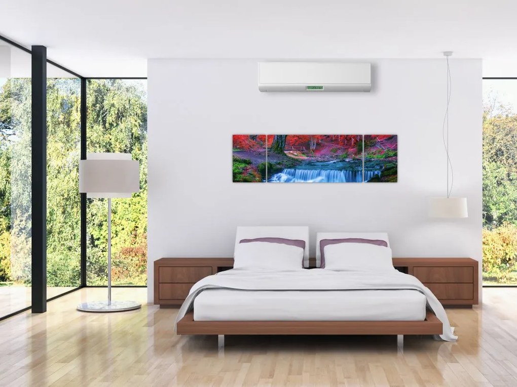 Obraz wodospadu w czerwonym lesie (170x50 cm)