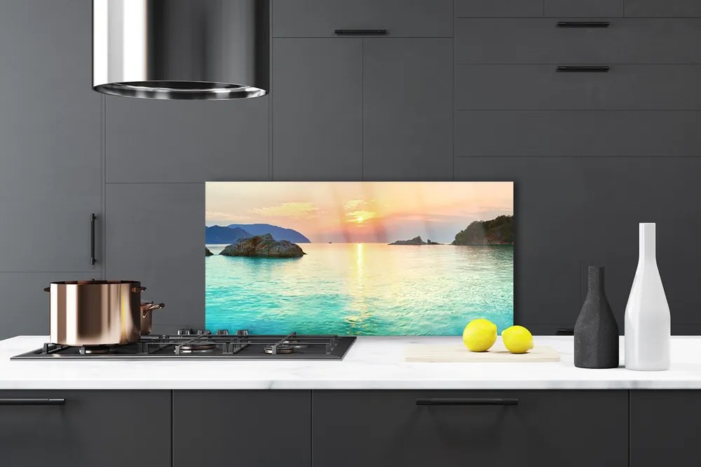 Panel Szklany Słoneczny Blask na Skalistym Brzegu