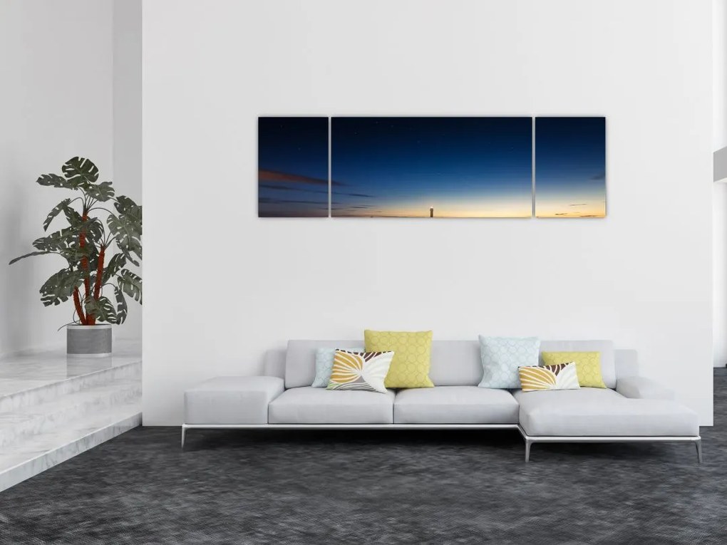 Obraz latarni morskiej w oddali (170x50 cm)