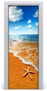 Naklejka DRZWI samoprzylepna Rozgwiazda na plaży