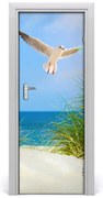 Naklejka na drzwi samoprzylepna Mewa nad wydmami