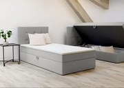 Jednoosobowe łóżko Bastian 90cm, posiada duży pojemnik, tapicerowane w kolorze szarym, lewe