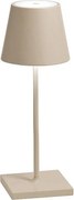 Lampa stołowa LED Poldina Pro Mini Sand, ładowalna i ściemnialna, z czasem pracy na baterii do 12 godzin.