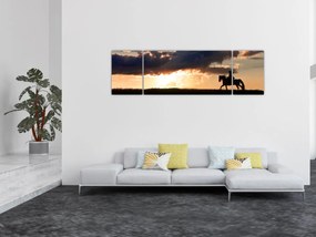 Obraz - Jeździec na koniu o zachodzie słońca (170x50 cm)