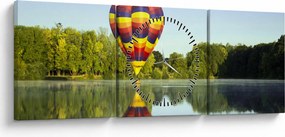 Obraz balonu na ogrzane powietrze nad jeziorem (z zegarem) (90x30 cm)