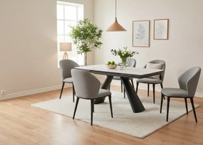 Elegancki stół z białym ceramicznym blatem na hartowanym szkle. Metalowa podstawa z czarnej stali nadaje mu nowoczesny charakter i wyjątkową trwałość.