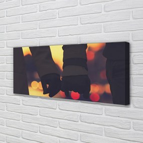 Zdjęcie na płótnie Dłonie w Blasku Świateł