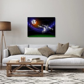 Obraz na szkle skaczącego piłkarza (70x50 cm)