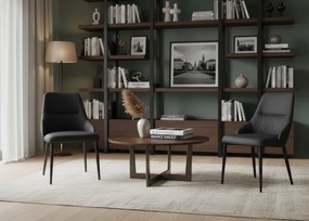 Eleganckie czarne krzesło Monolit tapicerowane ekoskórą PU, wygodne, nowoczesne i idealne do jadalni lub biura. Smukłe metalowe nogi dodają mu lekkości i stylu.