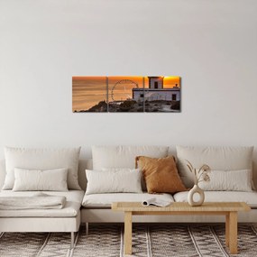 Obraz latarni morskiej o zachodzie słońca (z zegarem) (90x30 cm)