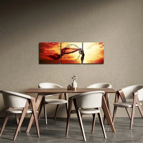 Obraz - Sylwetka kobiety o zachodzie słońca (z zegarem) (90x30 cm)