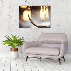 Obraz na szkle - świecąca żarówka (70x50 cm)