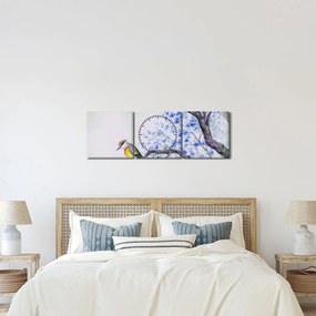 Obraz - ptak na drzewie z niebieskimi kwiatami (z zegarem) (90x30 cm)