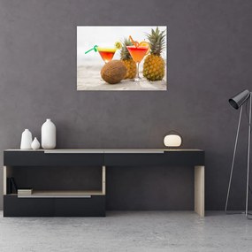 Obraz na szkle ananasów i szklanek na plaży (70x50 cm)